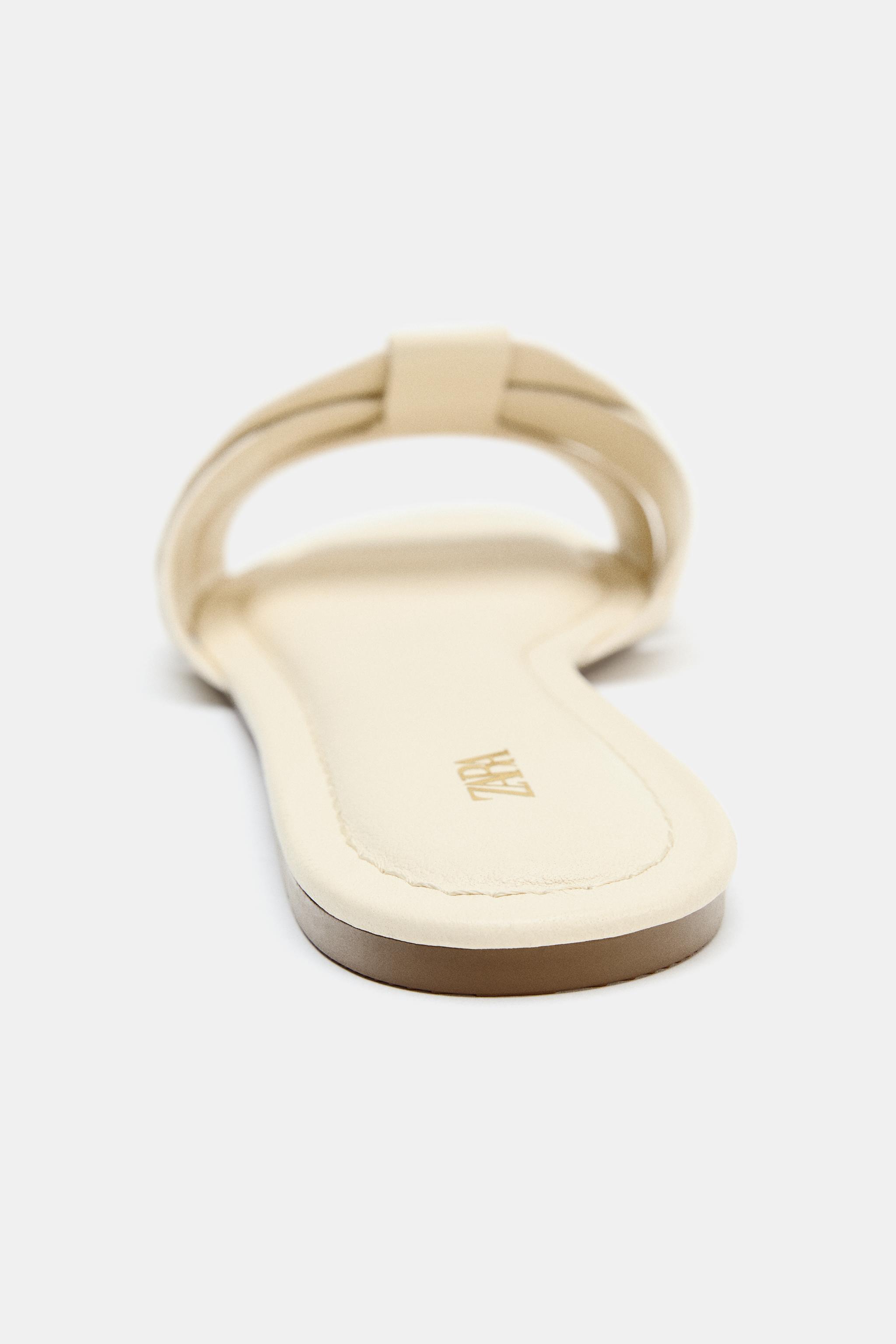 SANDALES PLATES EN CUIR À BRIDES CROISÉES